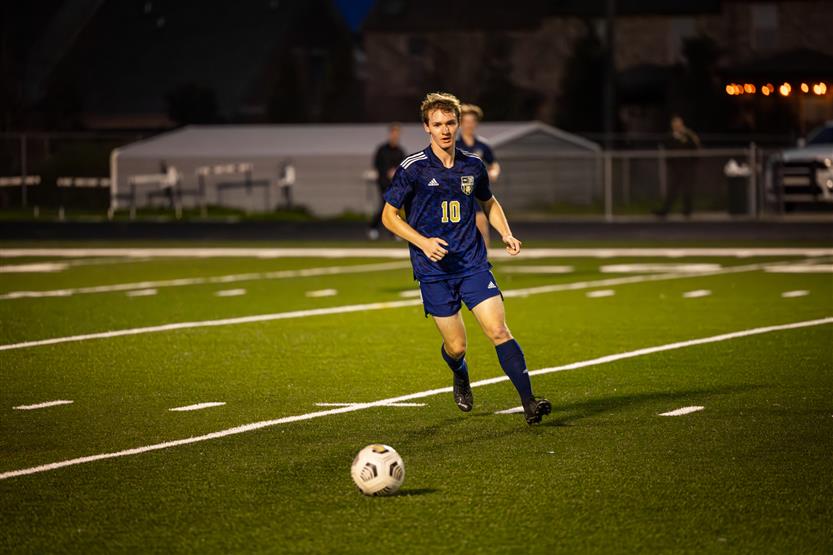 Students play soccer